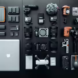 Several pieces of tech gear arranged neatly on flat surface